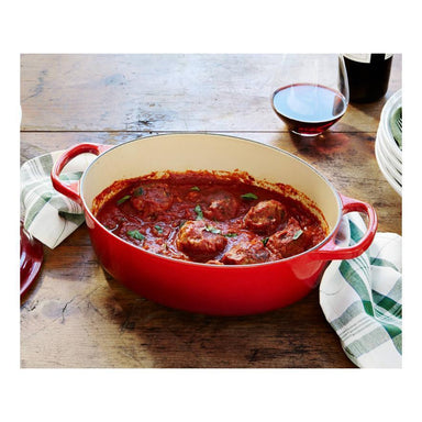 Le Creuset Oval Dutch Oven - 9.5-qt Cast Iron - Cherry Red – Cutlery and  More
