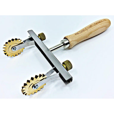 Pasta cutter wheel in brass with single toothed blade, olive handle